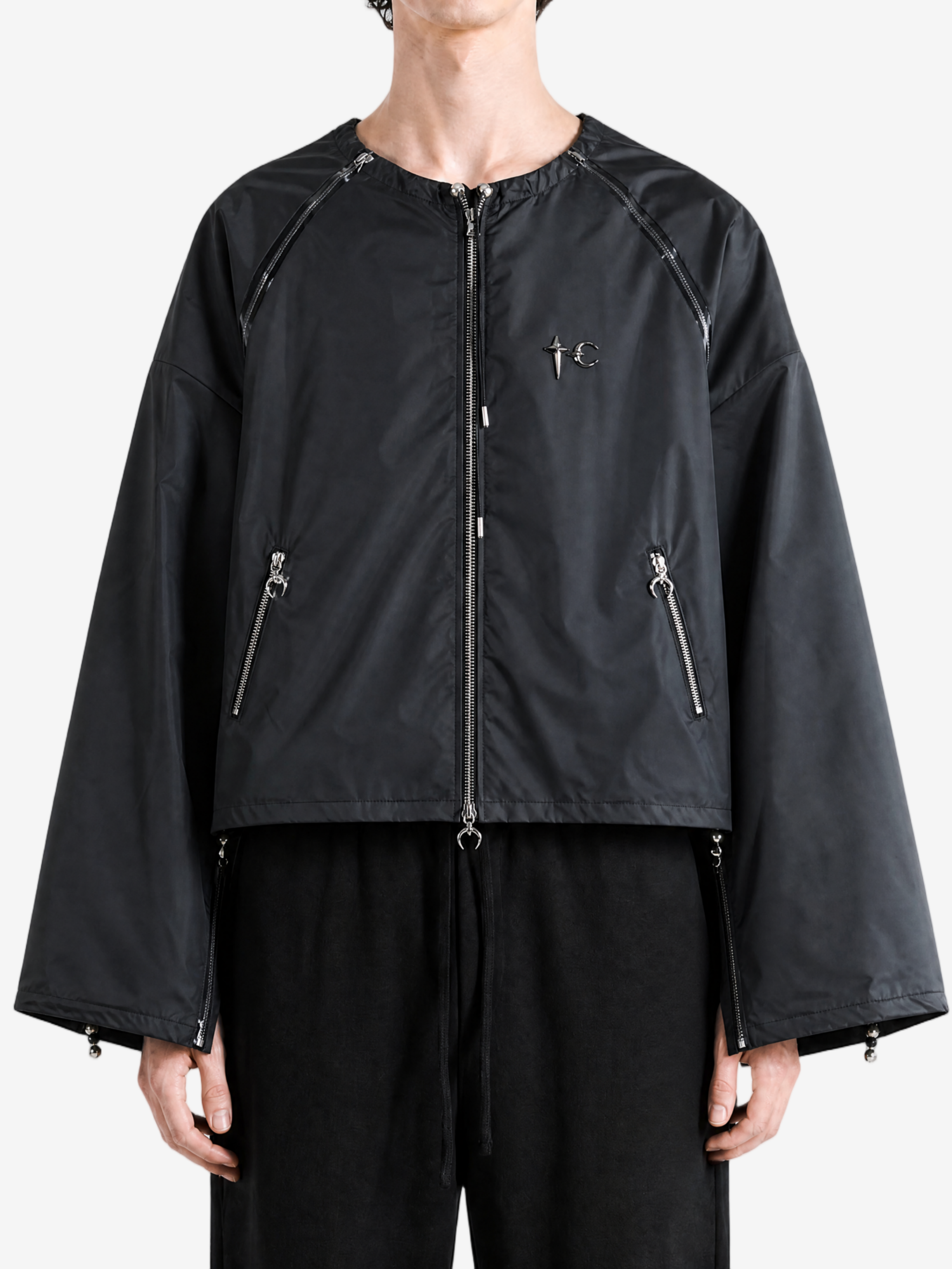 Black jacket worn by a person, showing the jacket fit