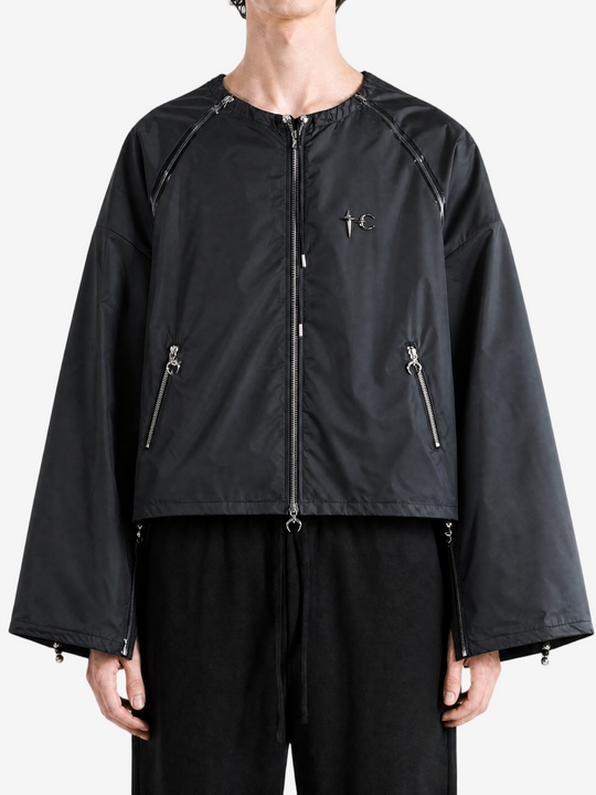 Black jacket worn by a person, showing the jacket fit