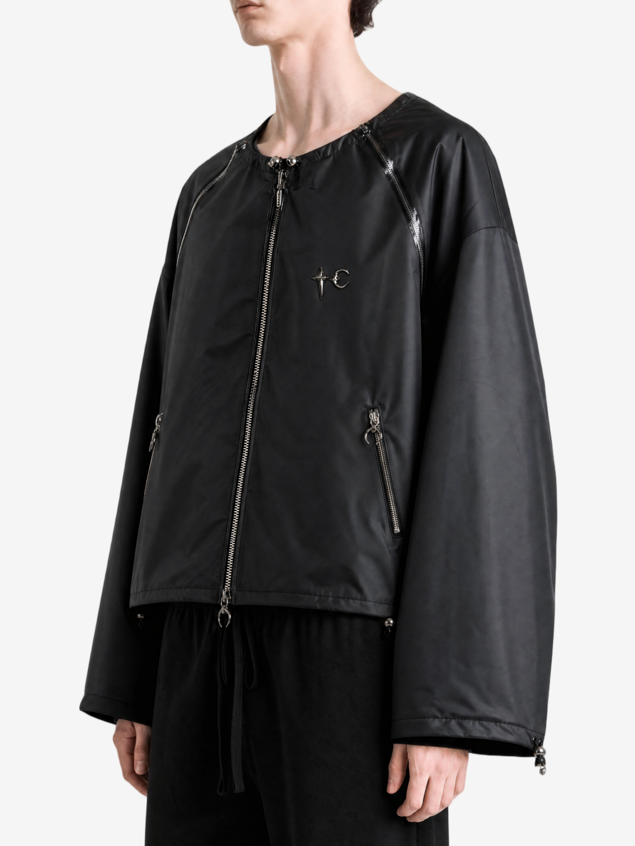 Black jacket worn by a person, side view