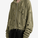 Green hoodie worn by a person, side view