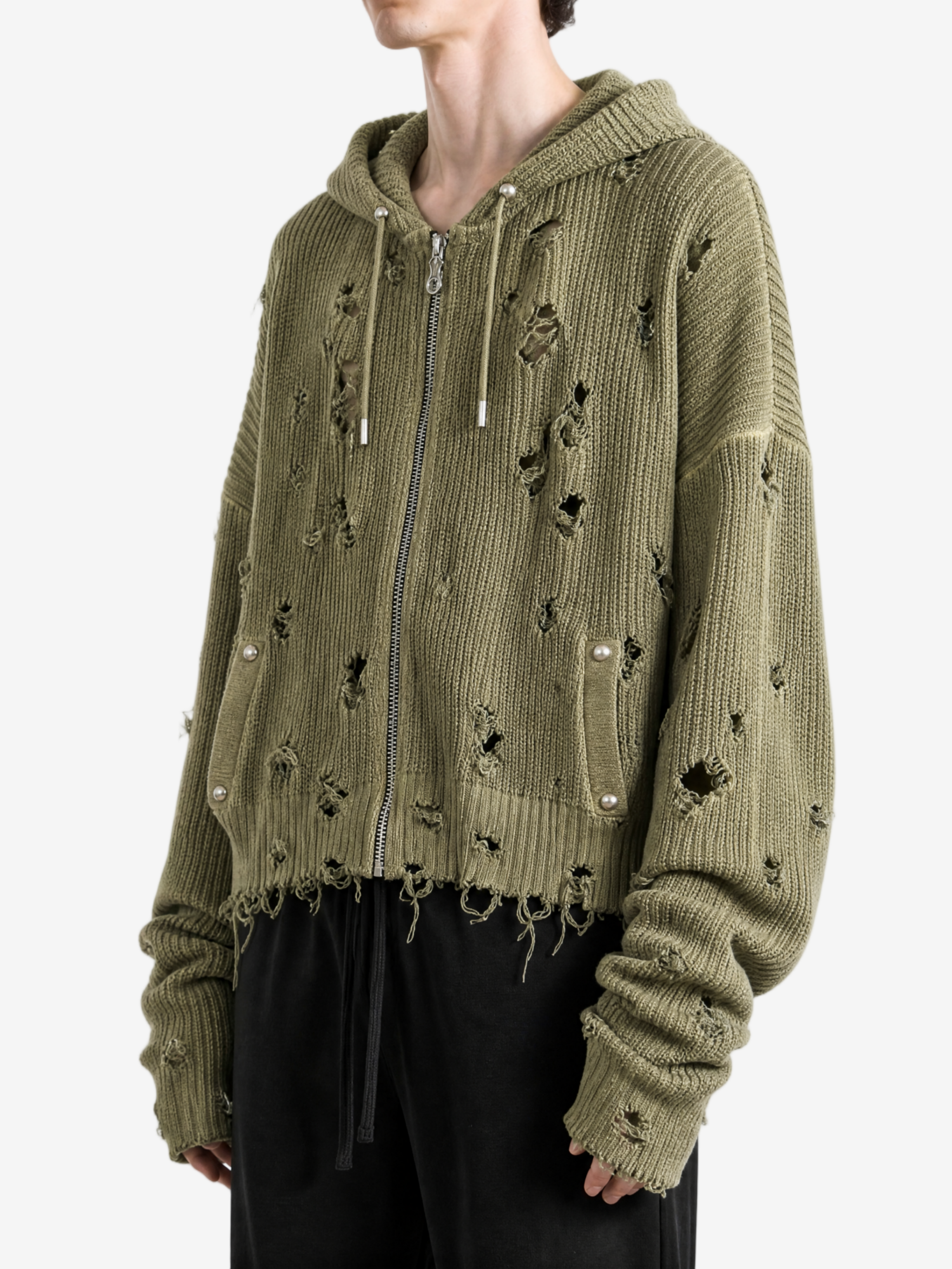 Green hoodie worn by a person, side view