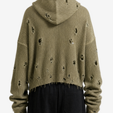 Green hoodie worn by a person, back view