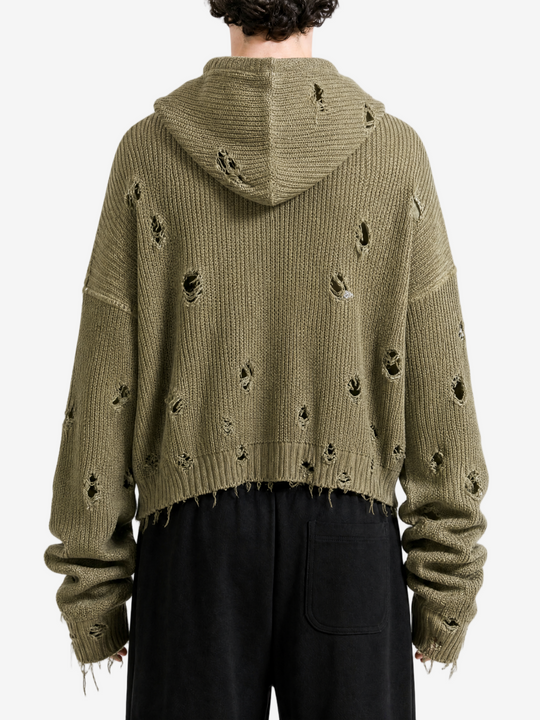 Green hoodie worn by a person, back view