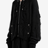 Black hoodie worn by a person, side view