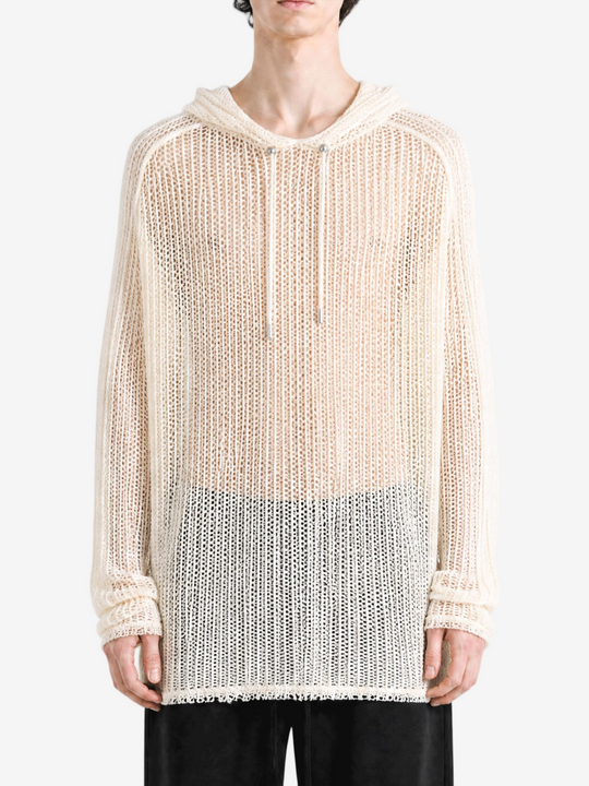 White knitwear worn by a person, showing the knitwear fit
