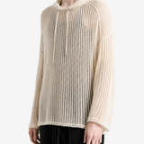White knitwear worn by a person, side view