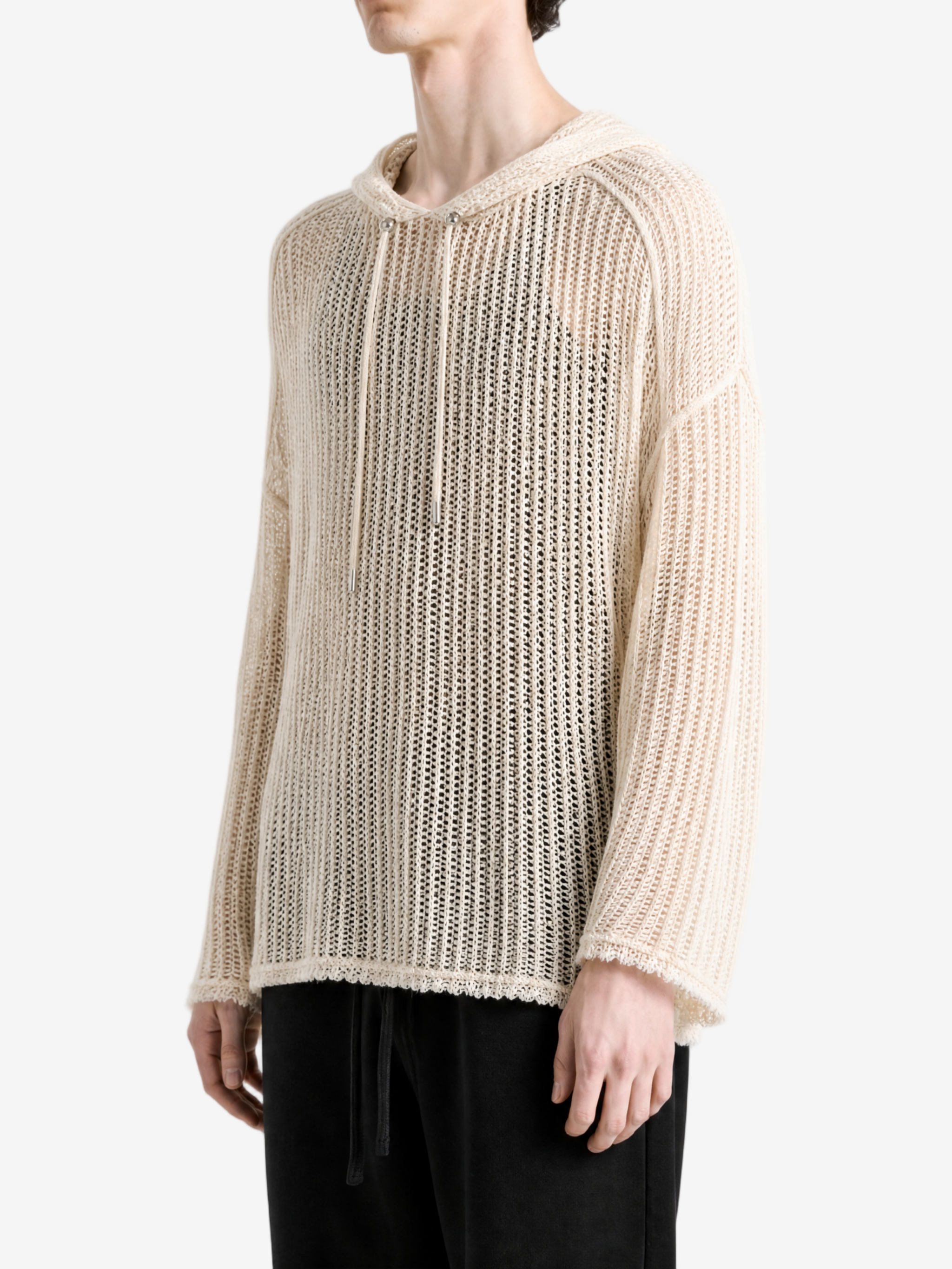 White knitwear worn by a person, side view