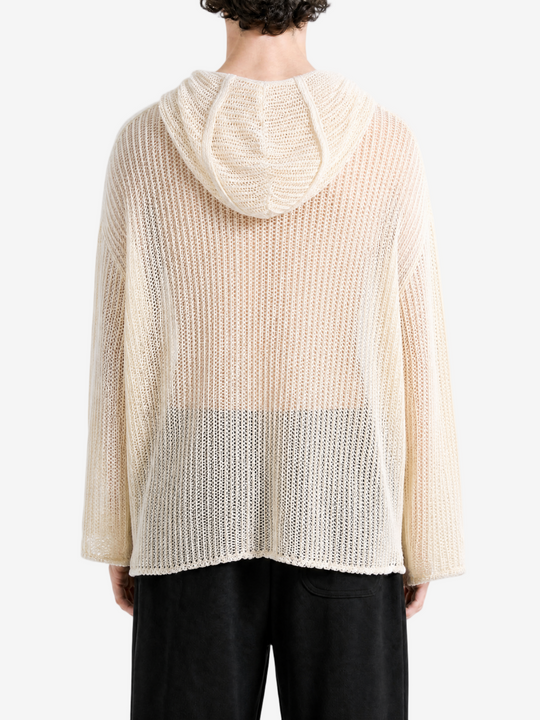 White knitwear worn by a person, back view