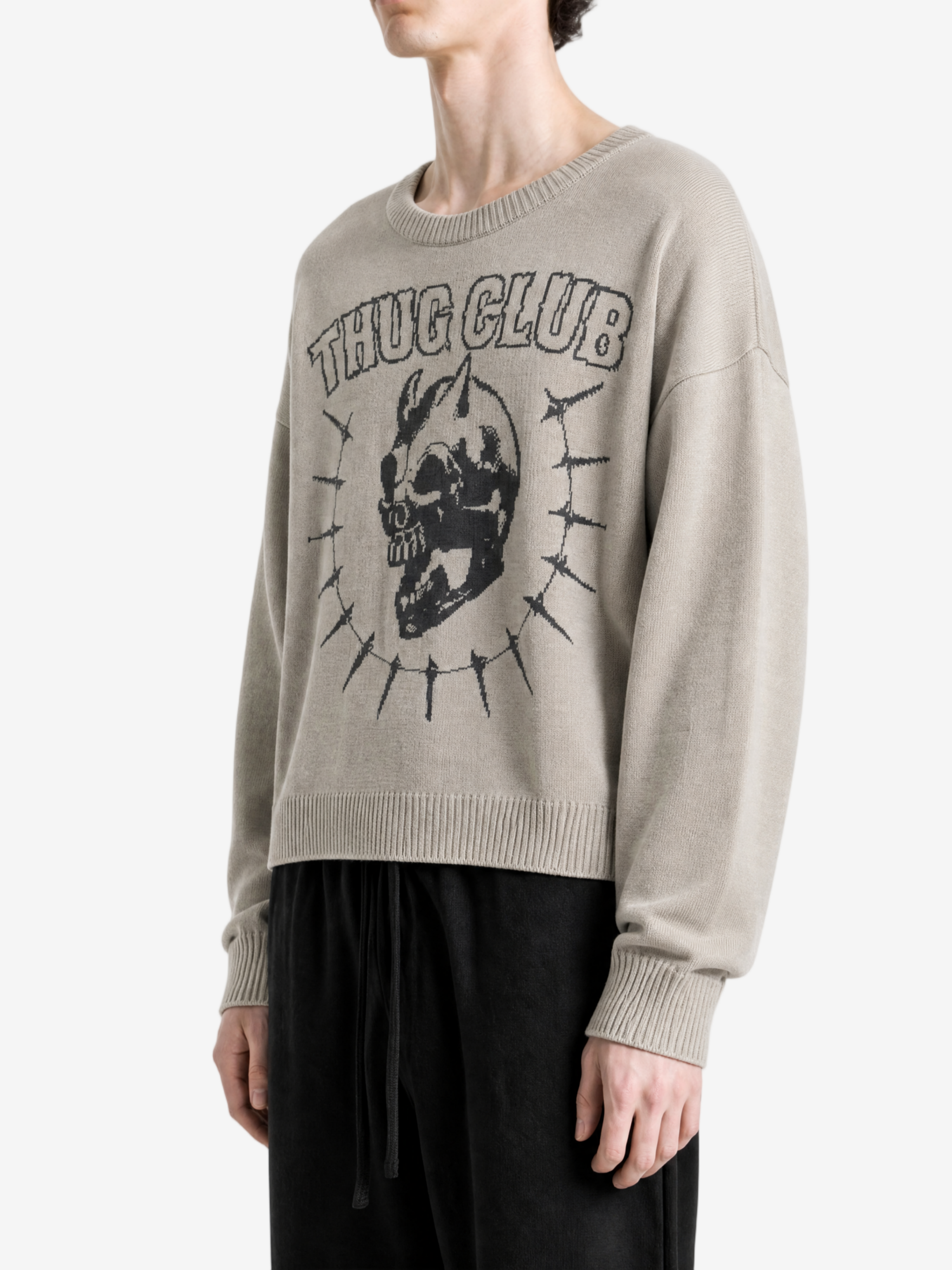 Grey knitwear worn by a person, side view