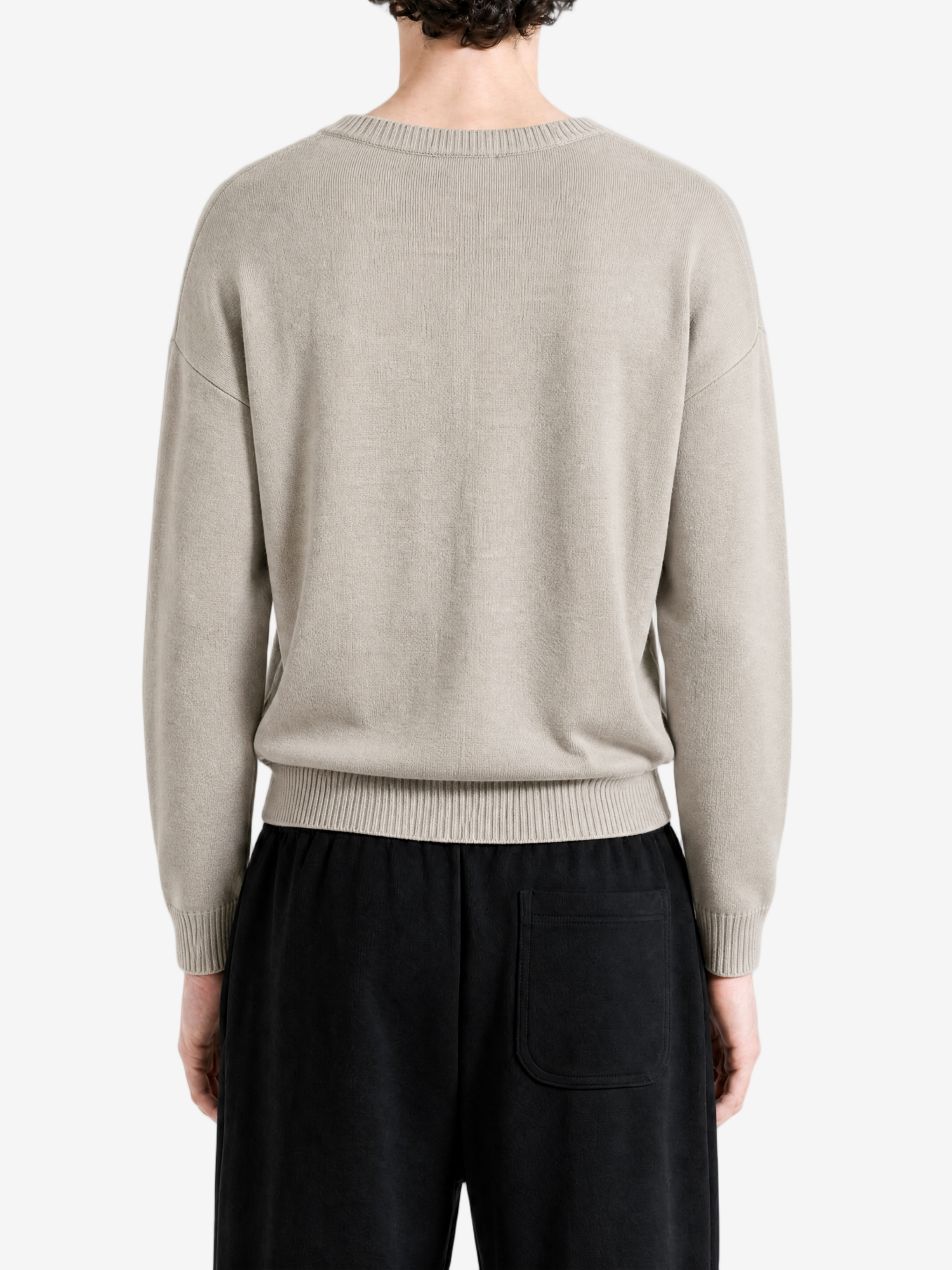 Grey knitwear worn by a person, back view