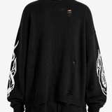 Black hoodie worn by a person, back view