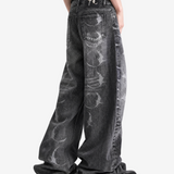 Grey pants worn by a person, side view