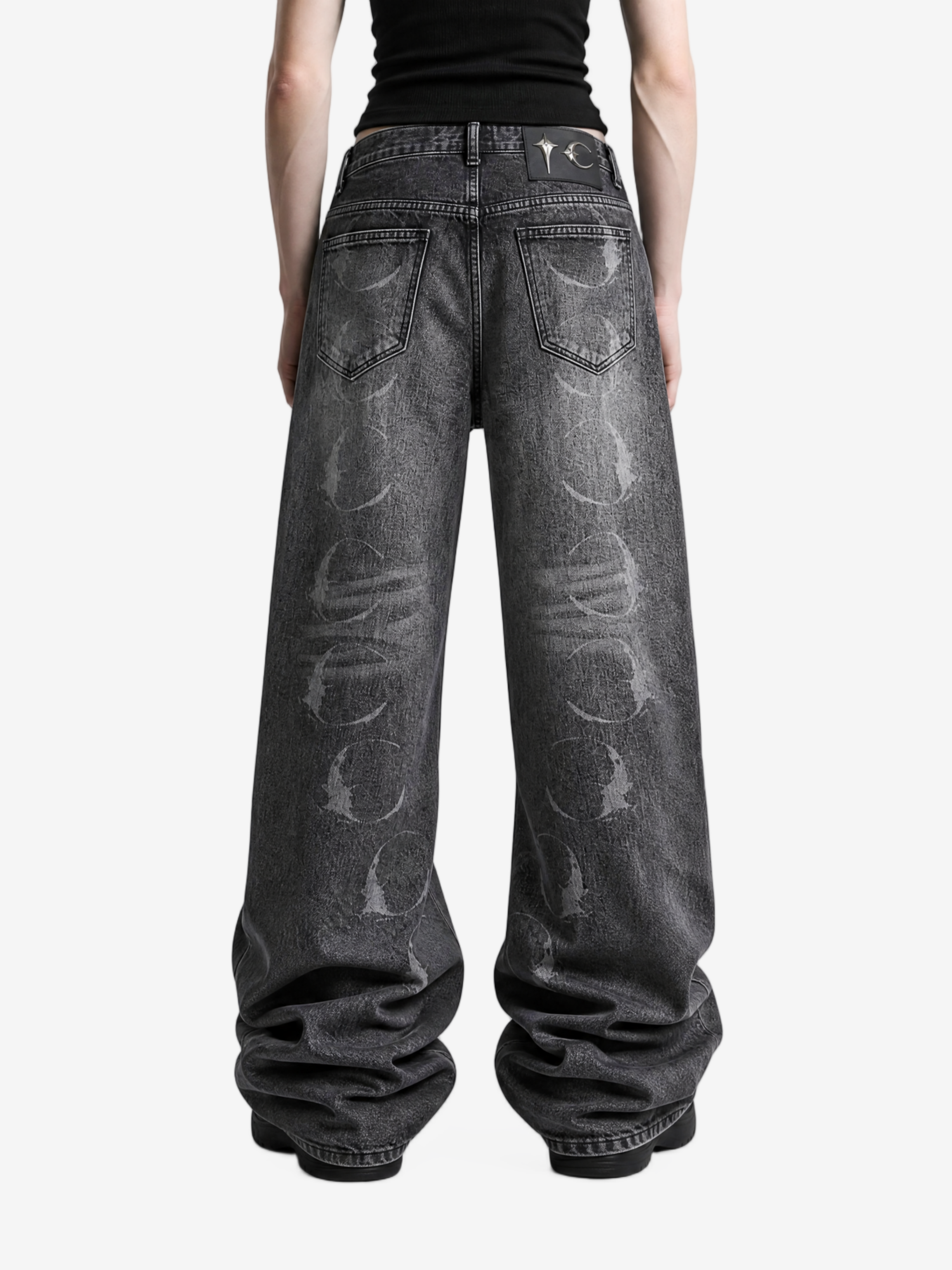 Grey pants worn by a person, back view