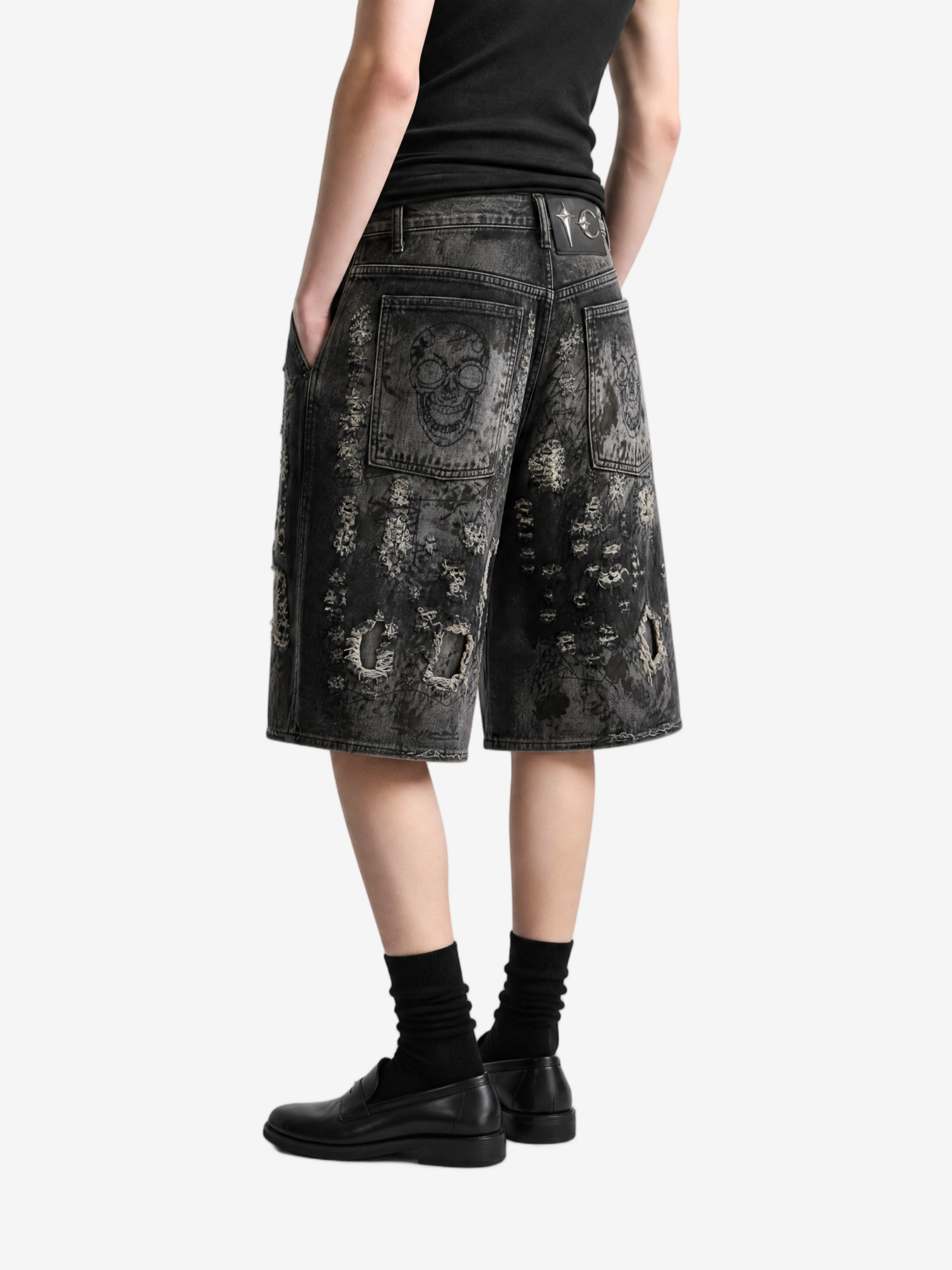 Black shorts worn by a person, side view
