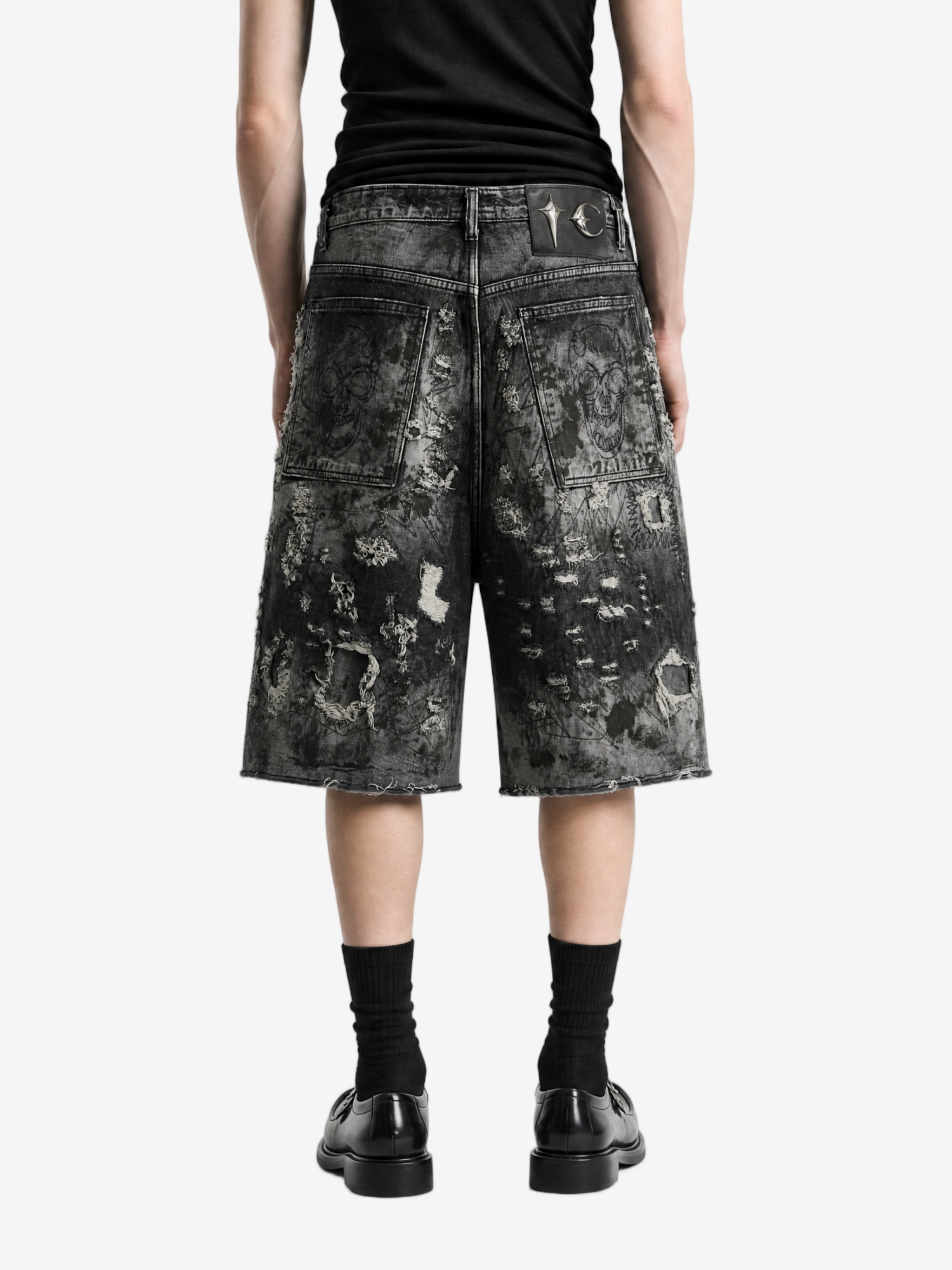 Black shorts worn by a person, back view