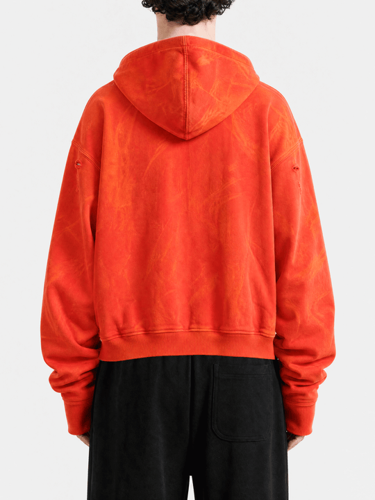 Red hoodie worn by a person, back view