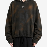 Brown hoodie worn by a person, showing the hoodie fit