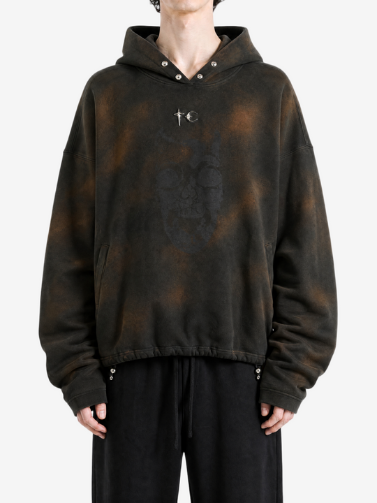 Brown hoodie worn by a person, showing the hoodie fit