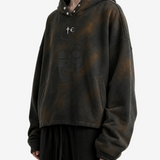 Brown hoodie worn by a person, side view