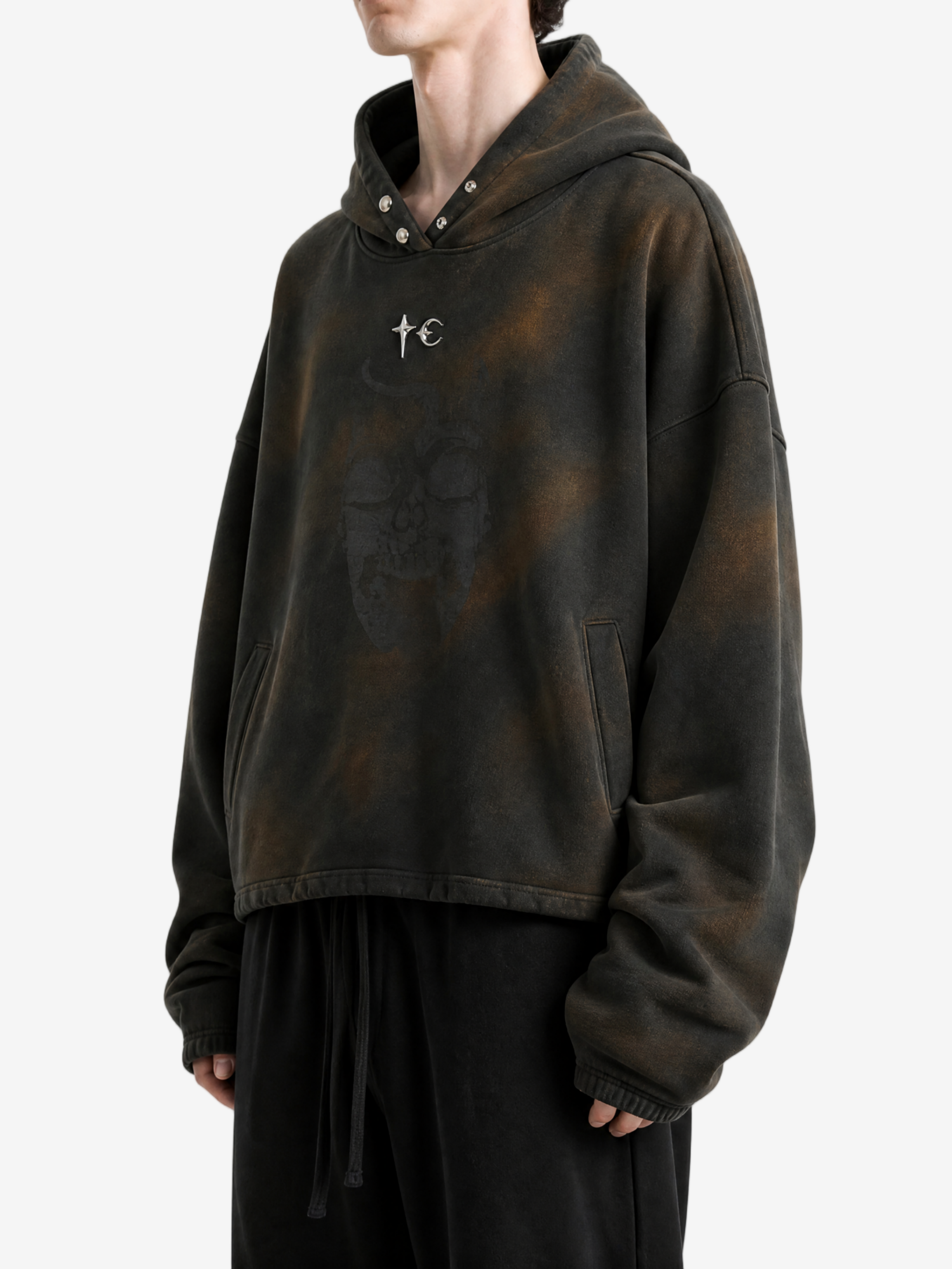 Brown hoodie worn by a person, side view