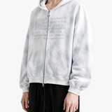 White hoodie worn by a person, side view