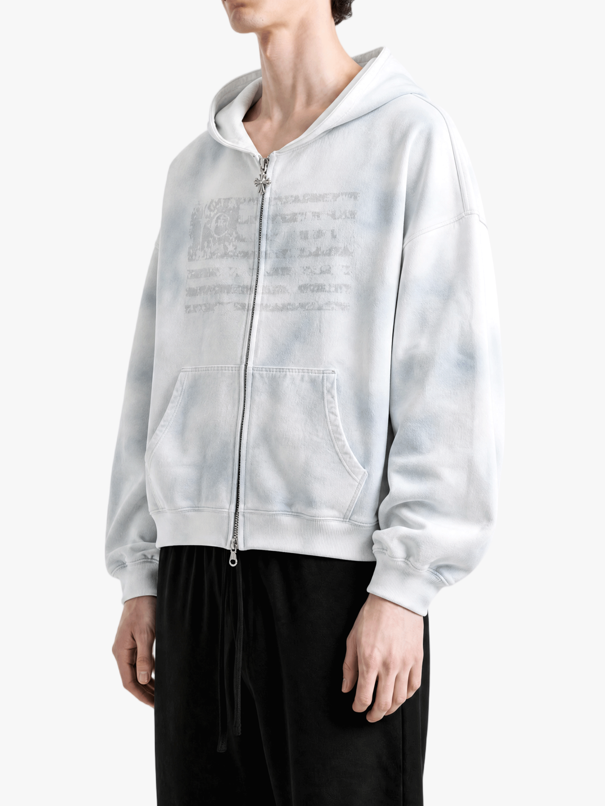 White hoodie worn by a person, side view
