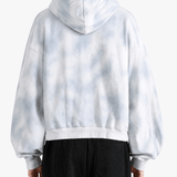 White hoodie worn by a person, back view