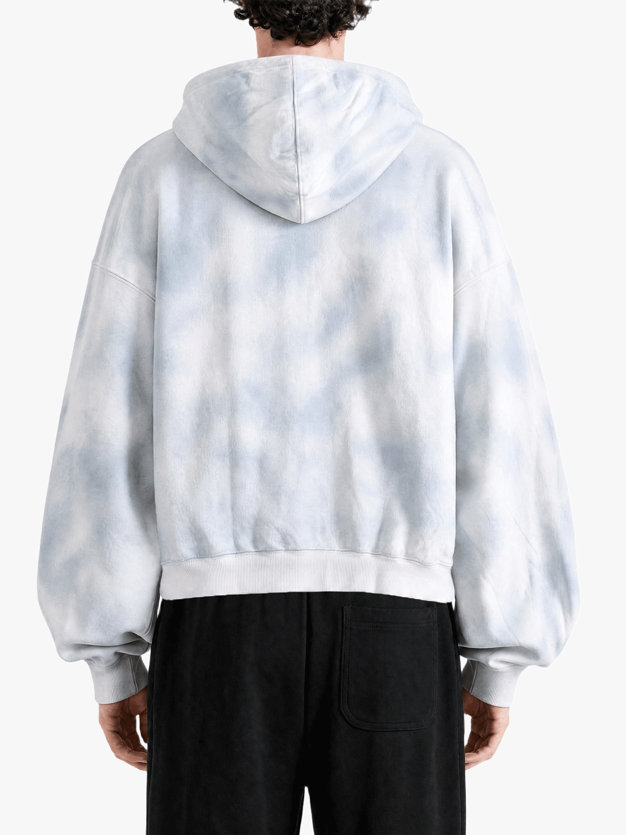 White hoodie worn by a person, back view