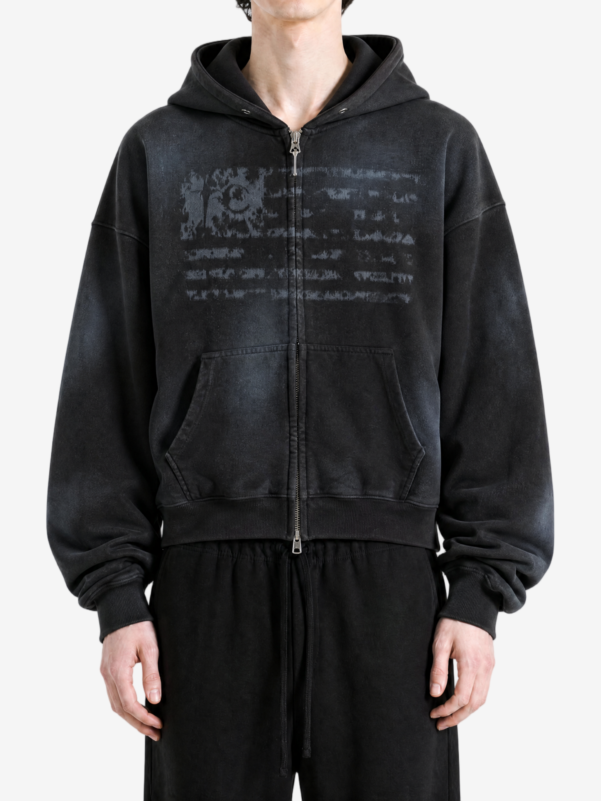 Black hoodie worn by a person, showing the hoodie fit