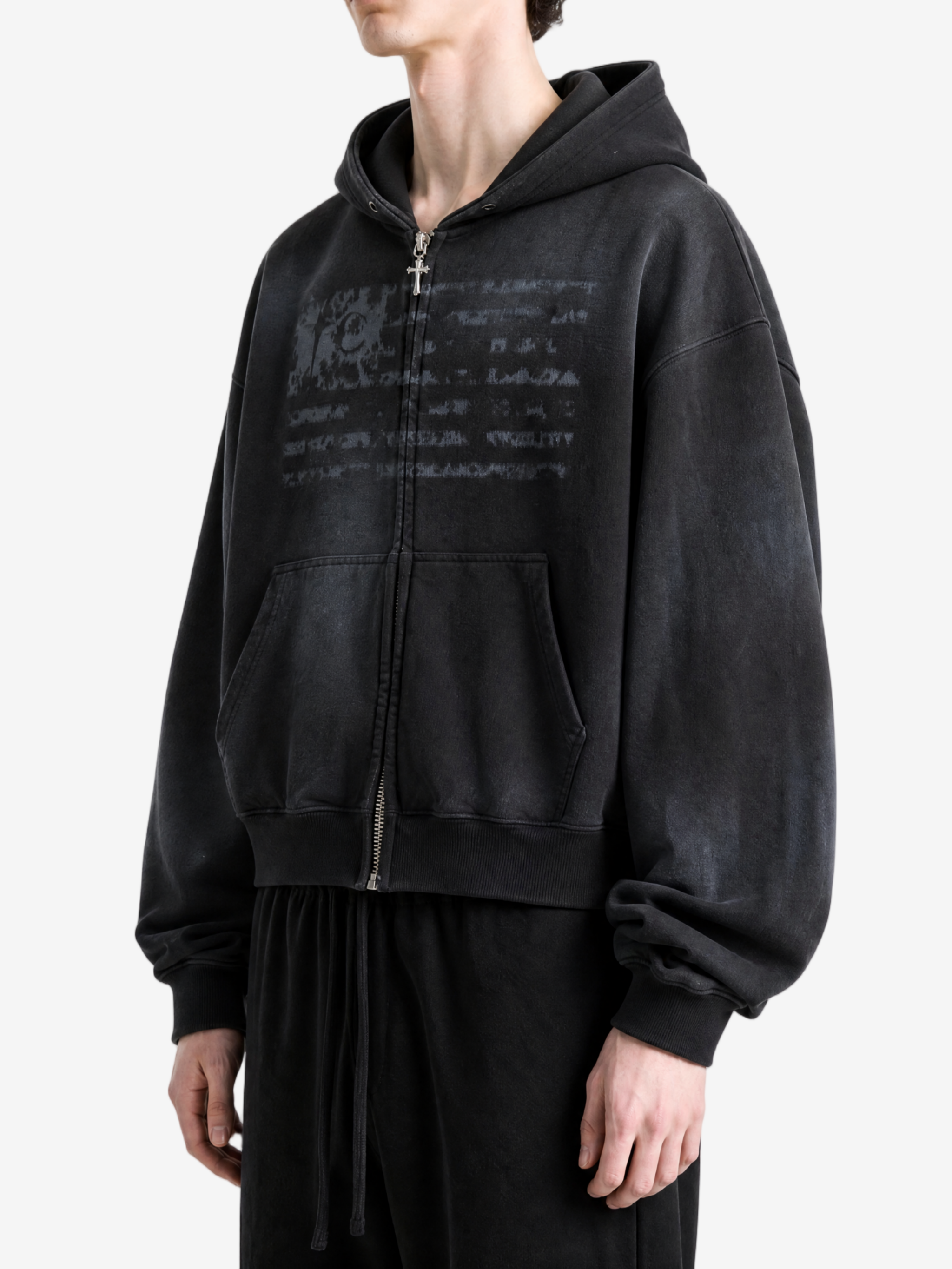 Black hoodie worn by a person, side view