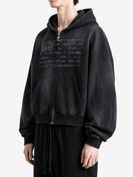 Black hoodie worn by a person, side view