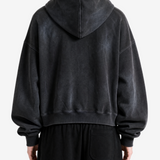 Black hoodie worn by a person, back view