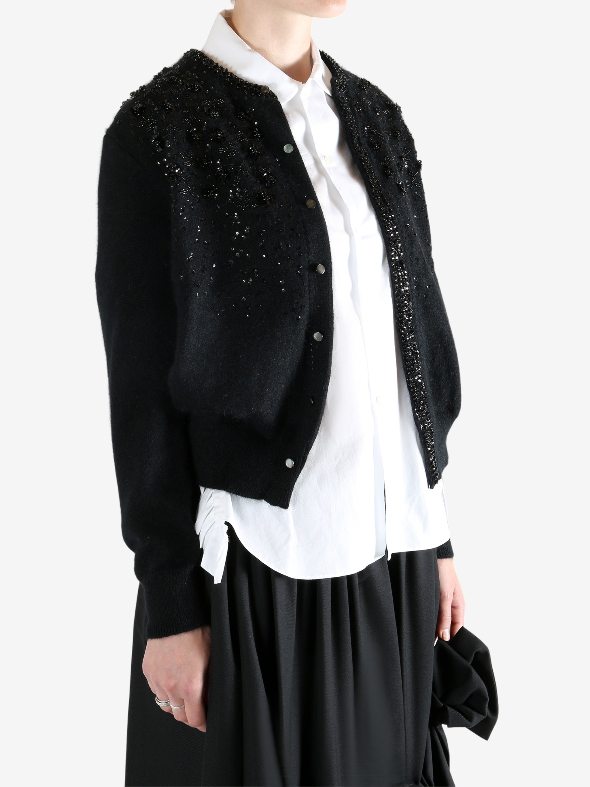 black Cardigan worn by a person, showing the Cardigan fit