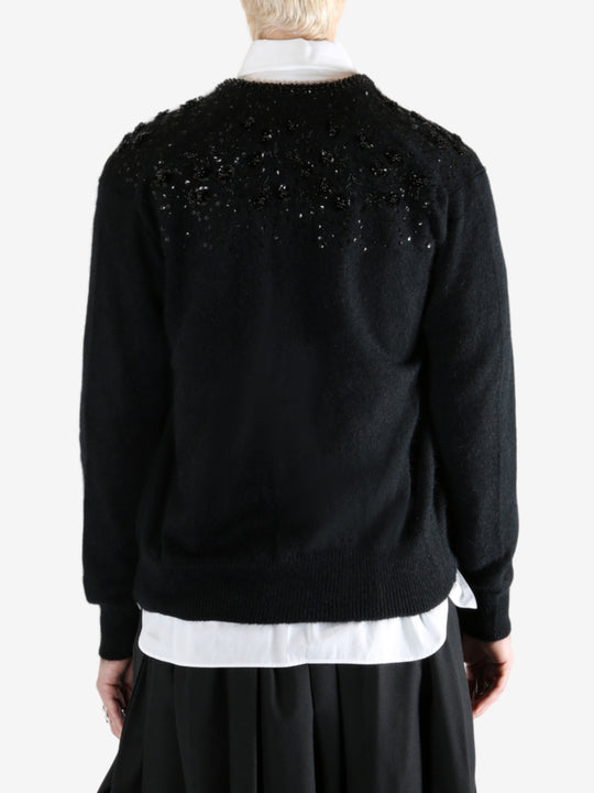 black Cardigan worn by a person, showing the Cardigan fit