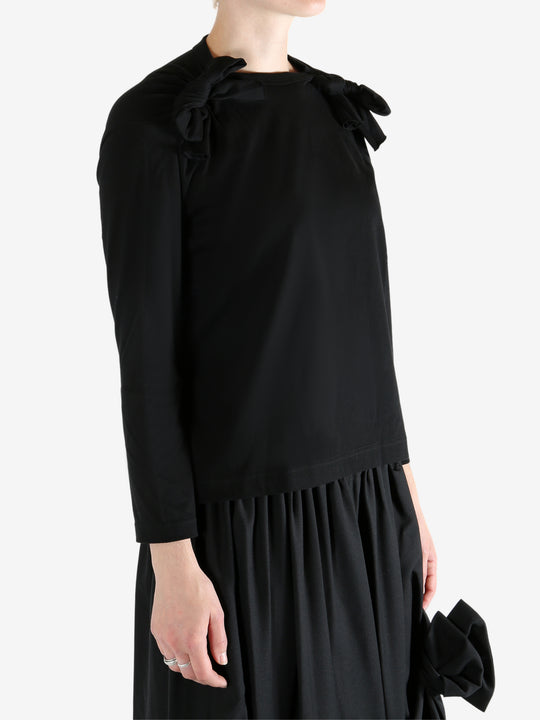 Black t-shirt worn by a person, showing the t-shirt fit