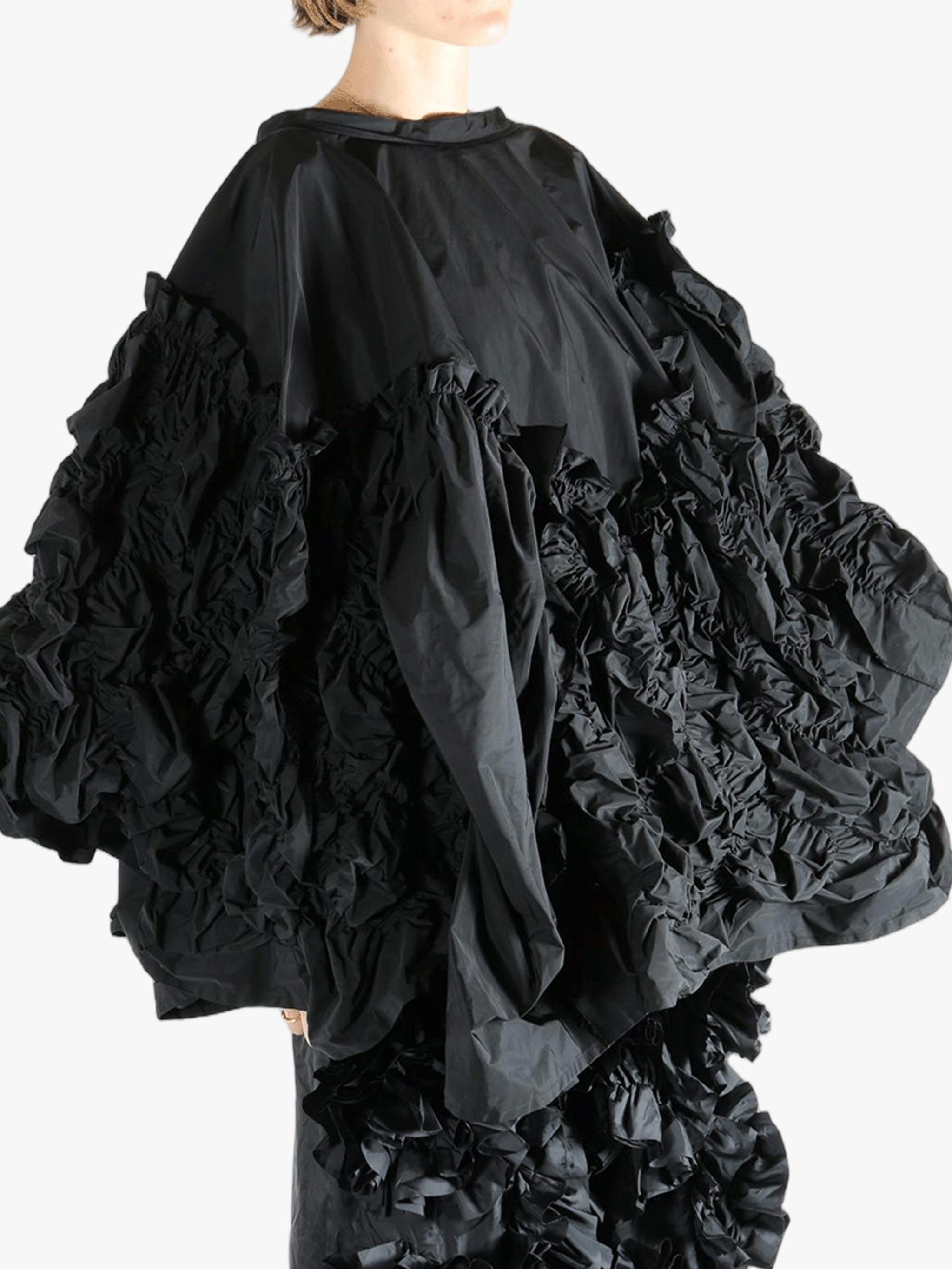 Black top  worn by a person, showing the top 's fit