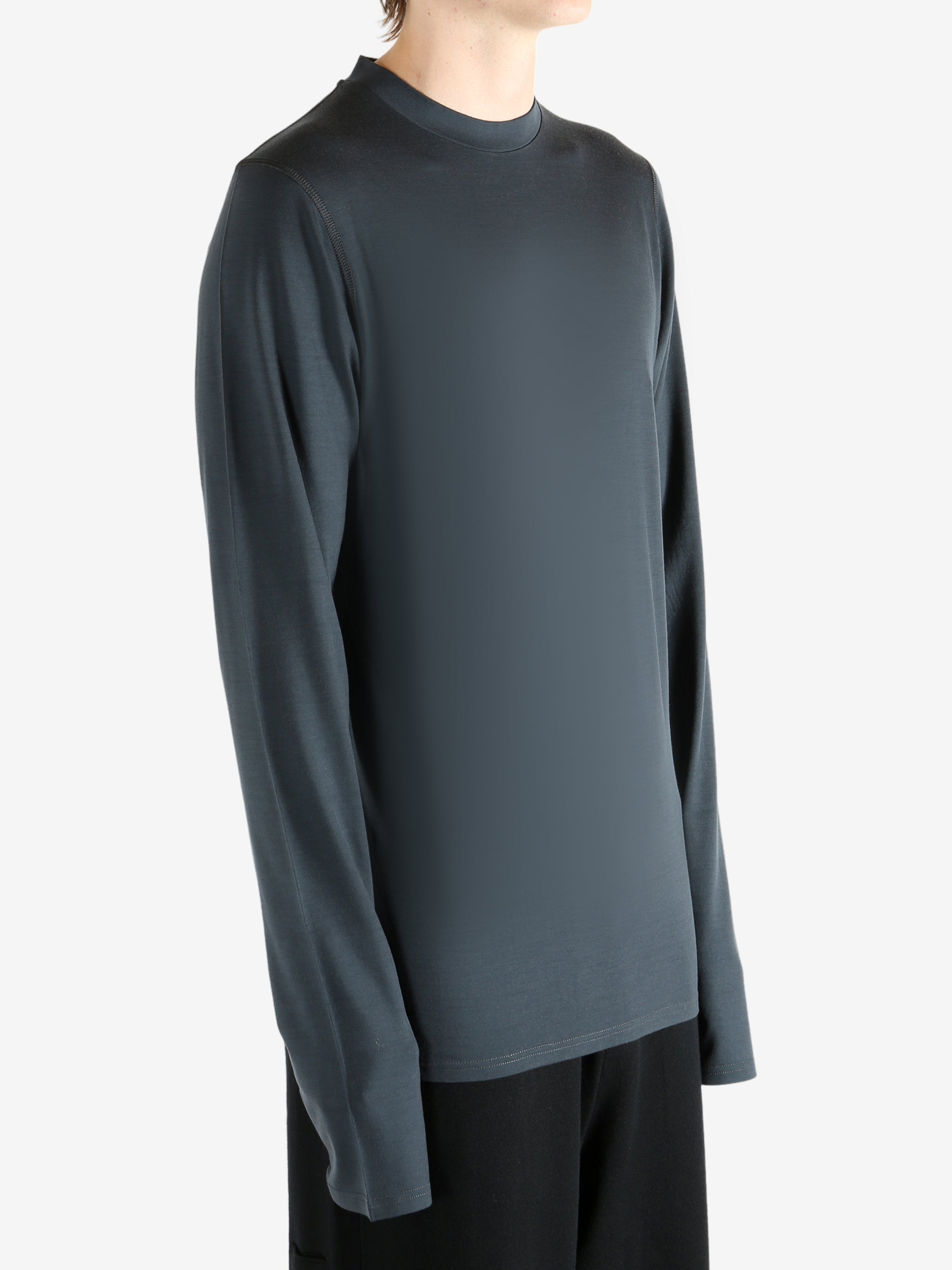 Black jersey worn by a person, showing the jersey's fit