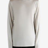 White jersey worn by a person, showing the jersey's fit