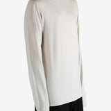 White jersey worn by a person, showing the jersey's fit