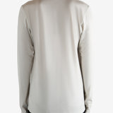 White jersey worn by a person, showing the jersey's fit