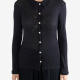 Navy shirt worn by a person, showing the shirt's fit