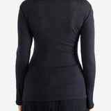 Navy shirt worn by a person, showing the shirt's fit