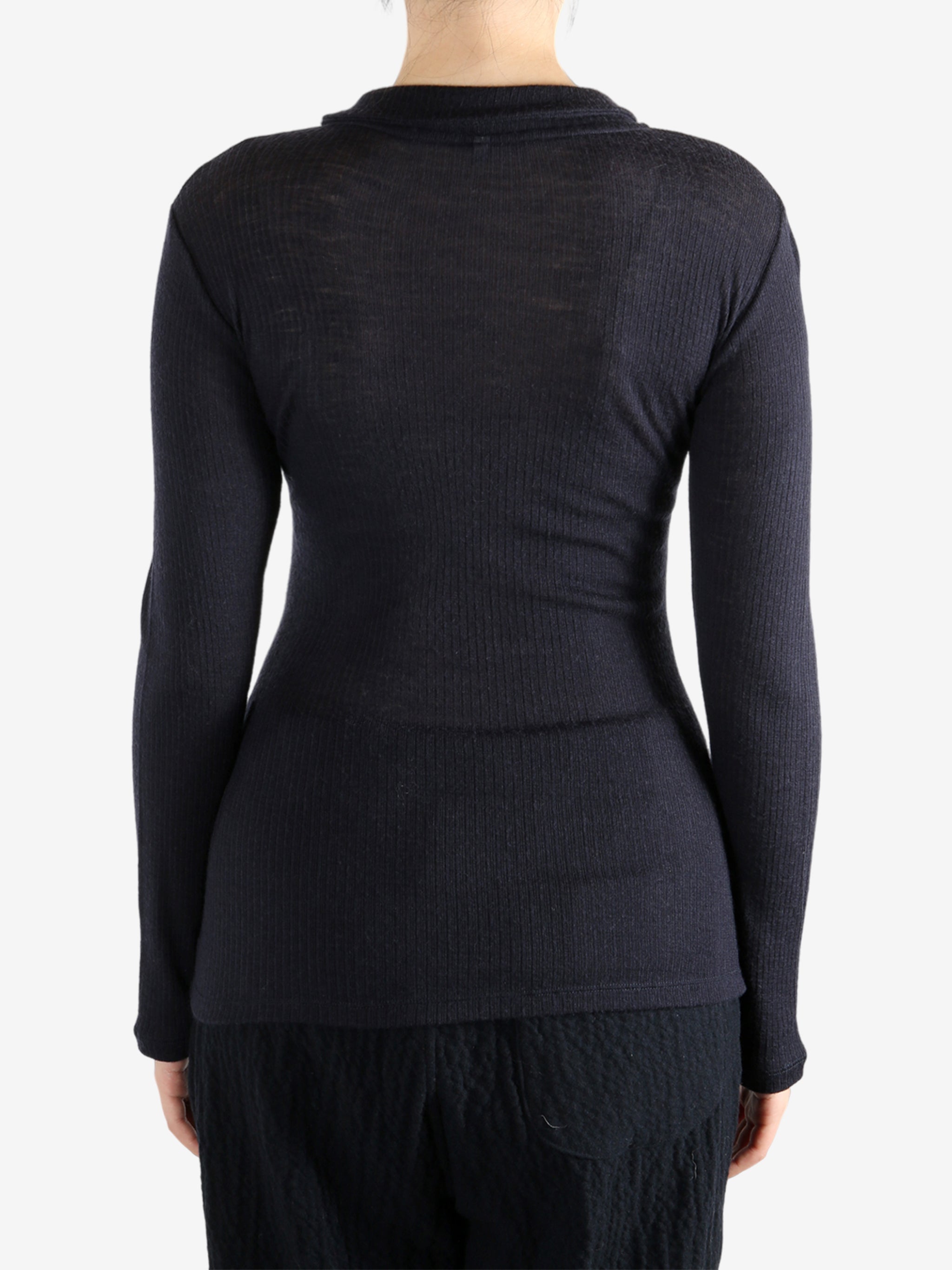 Navy shirt worn by a person, showing the shirt's fit