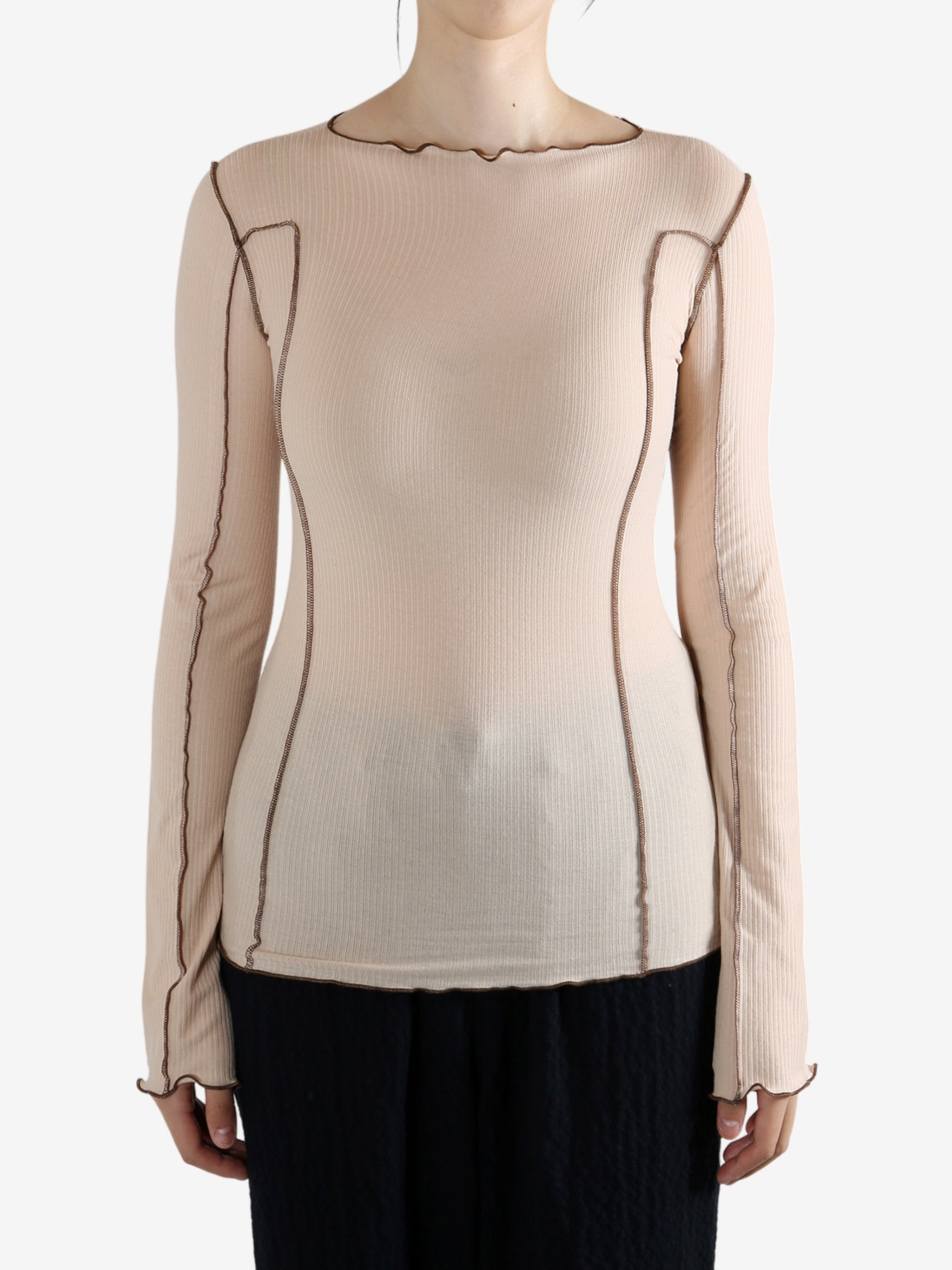 Tan shirt worn by a person, showing the shirt's fit