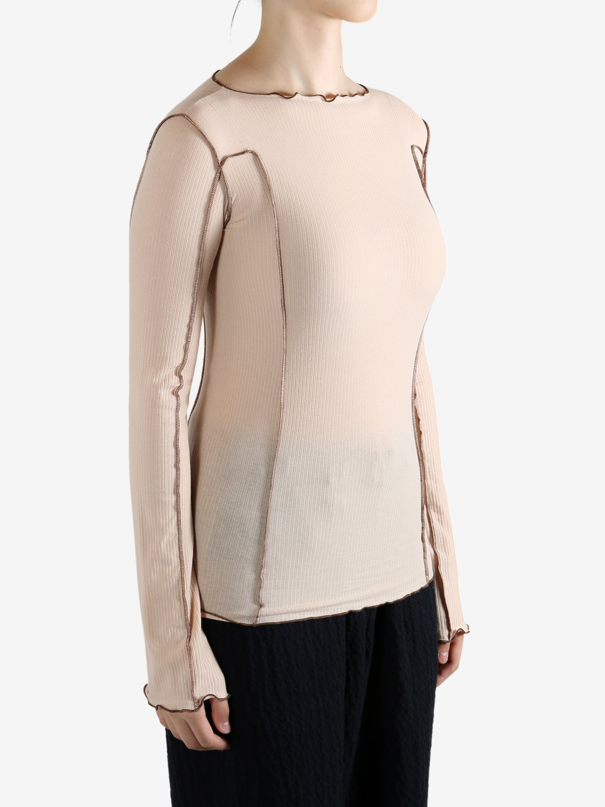 Tan shirt worn by a person, showing the shirt's fit