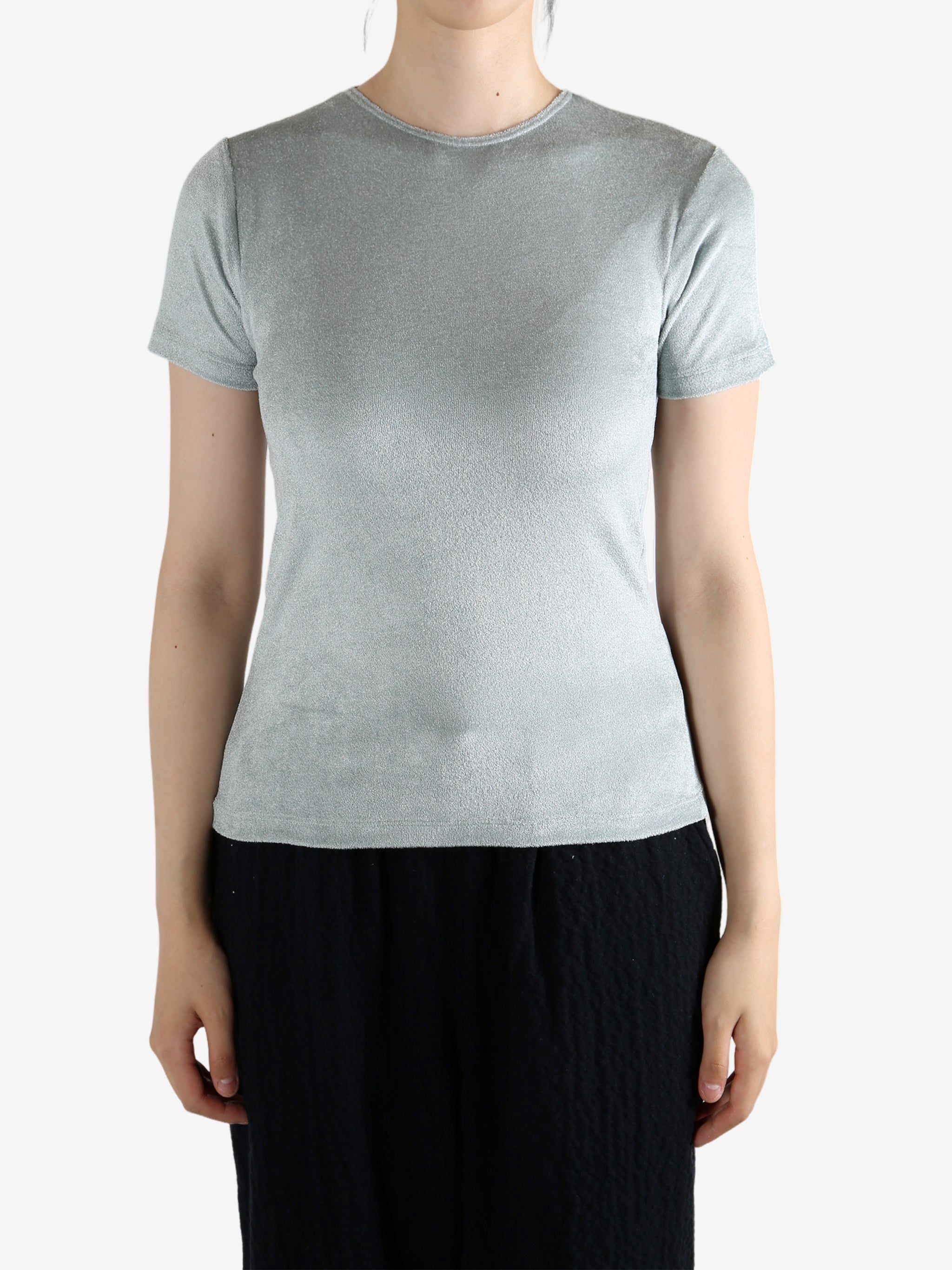 Grey shirt worn by a person, showing the shirt's fit