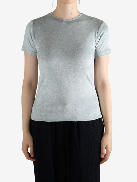 Grey shirt worn by a person, showing the shirt's fit