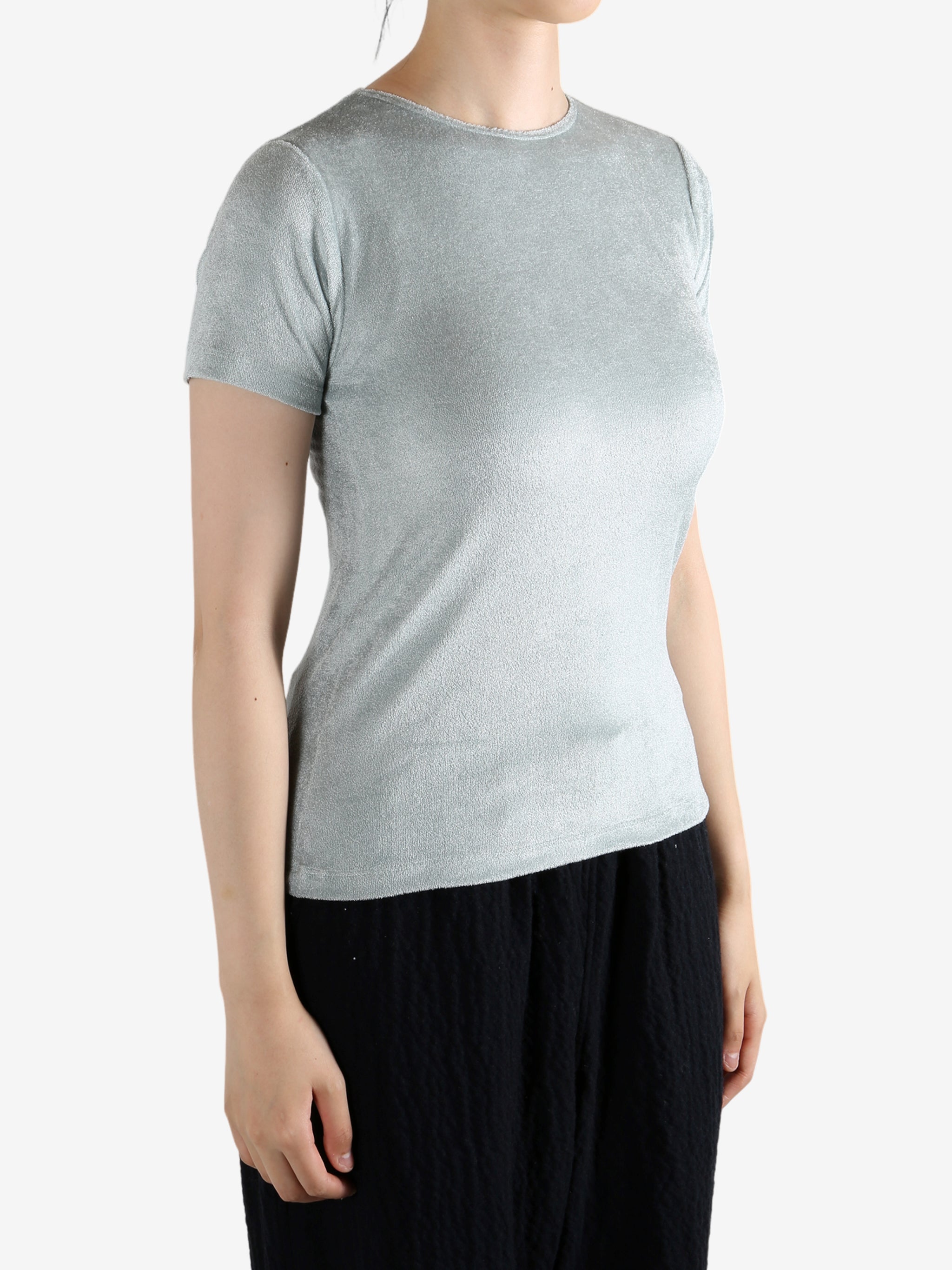 Grey shirt worn by a person, showing the shirt's fit