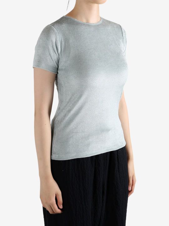 Grey shirt worn by a person, showing the shirt's fit