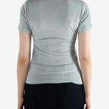 Grey shirt worn by a person, showing the shirt's fit